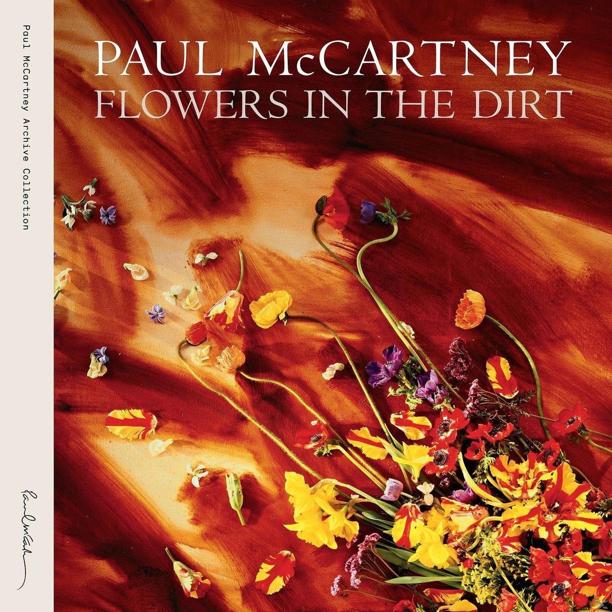 Albumcover mit Blumen. Titel: 'Paul McCartney Flowers in the Dirt'. Rote, gelbe, lila Blumen mit rotem Hintergrund.