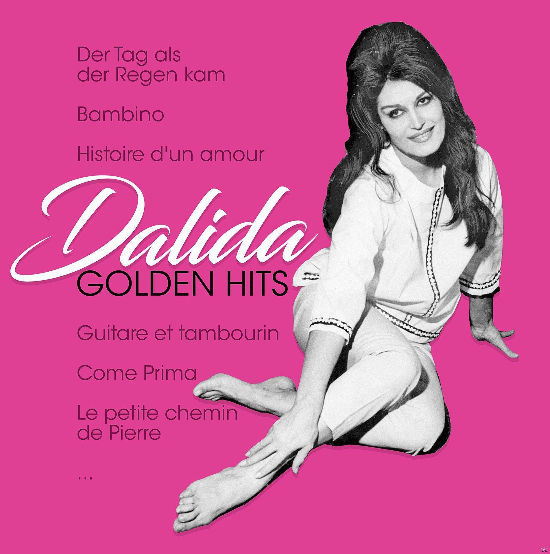 Albumcover. Frau in weißem Outfit auf pinkfarbenem Hintergrund. Text: Dalida Golden Hits. Titelliste.