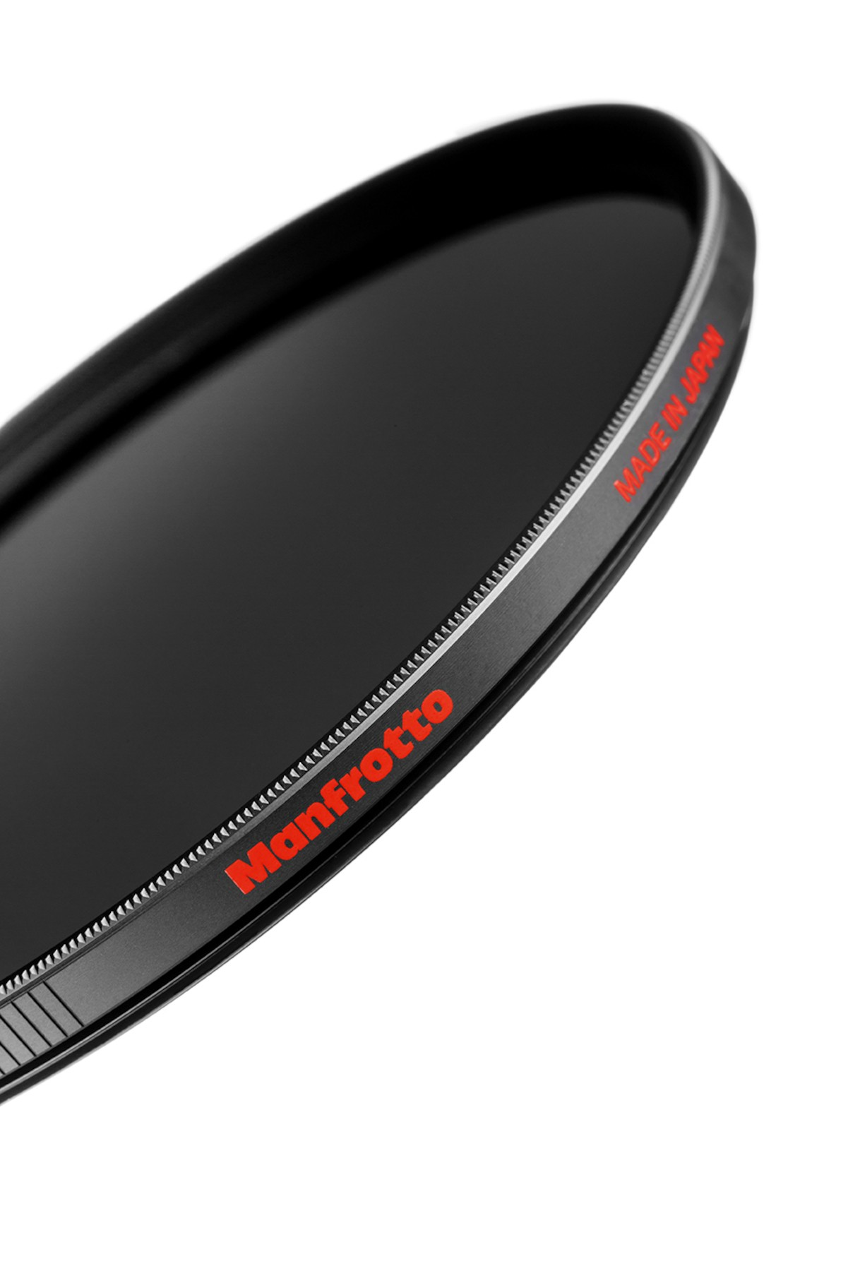 Black Manfrotto lens filter with red text, Made in Japan. The filter is circular against a white background.