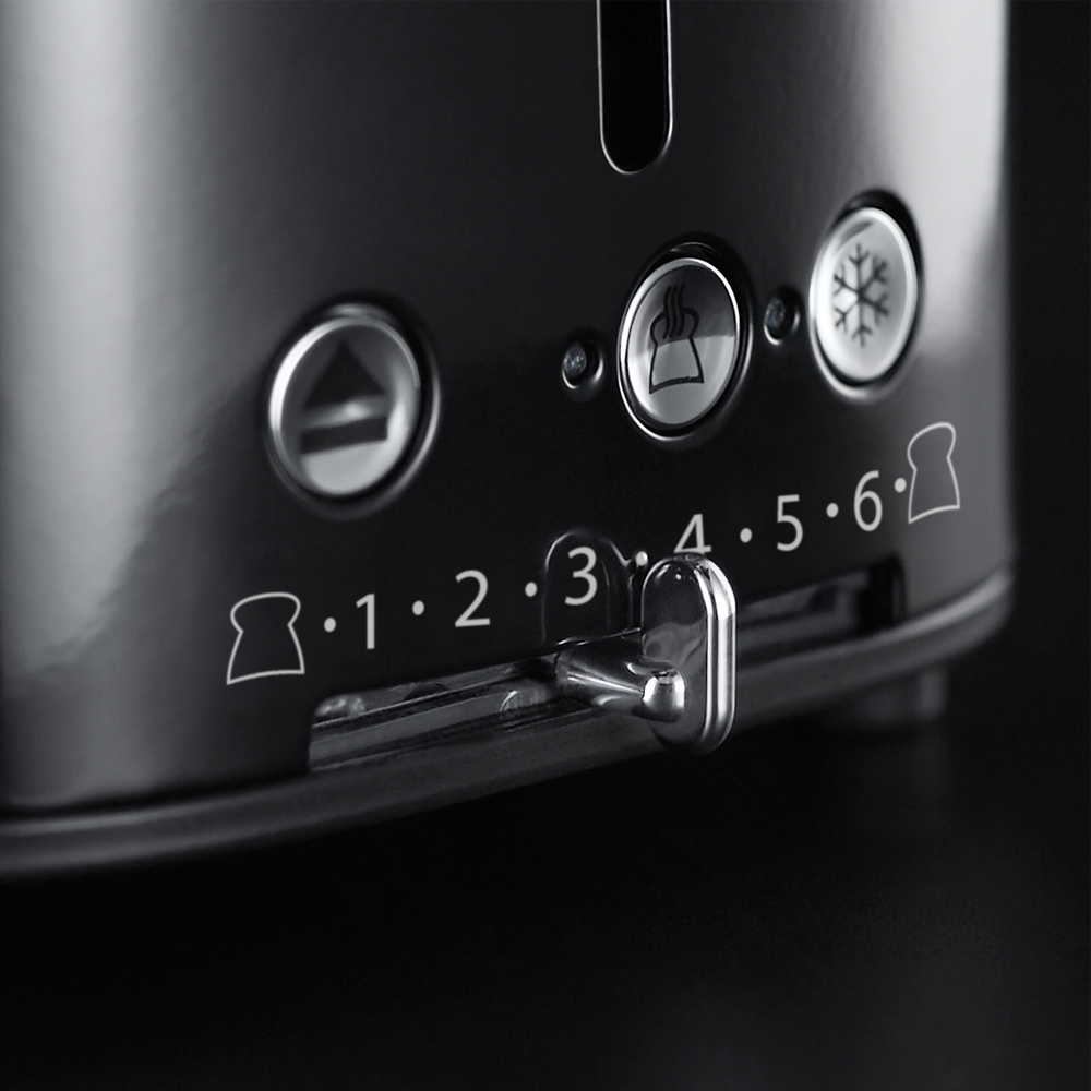 Black toaster with numbered settings and lever. Controls for defrost, reheat, and browning levels.