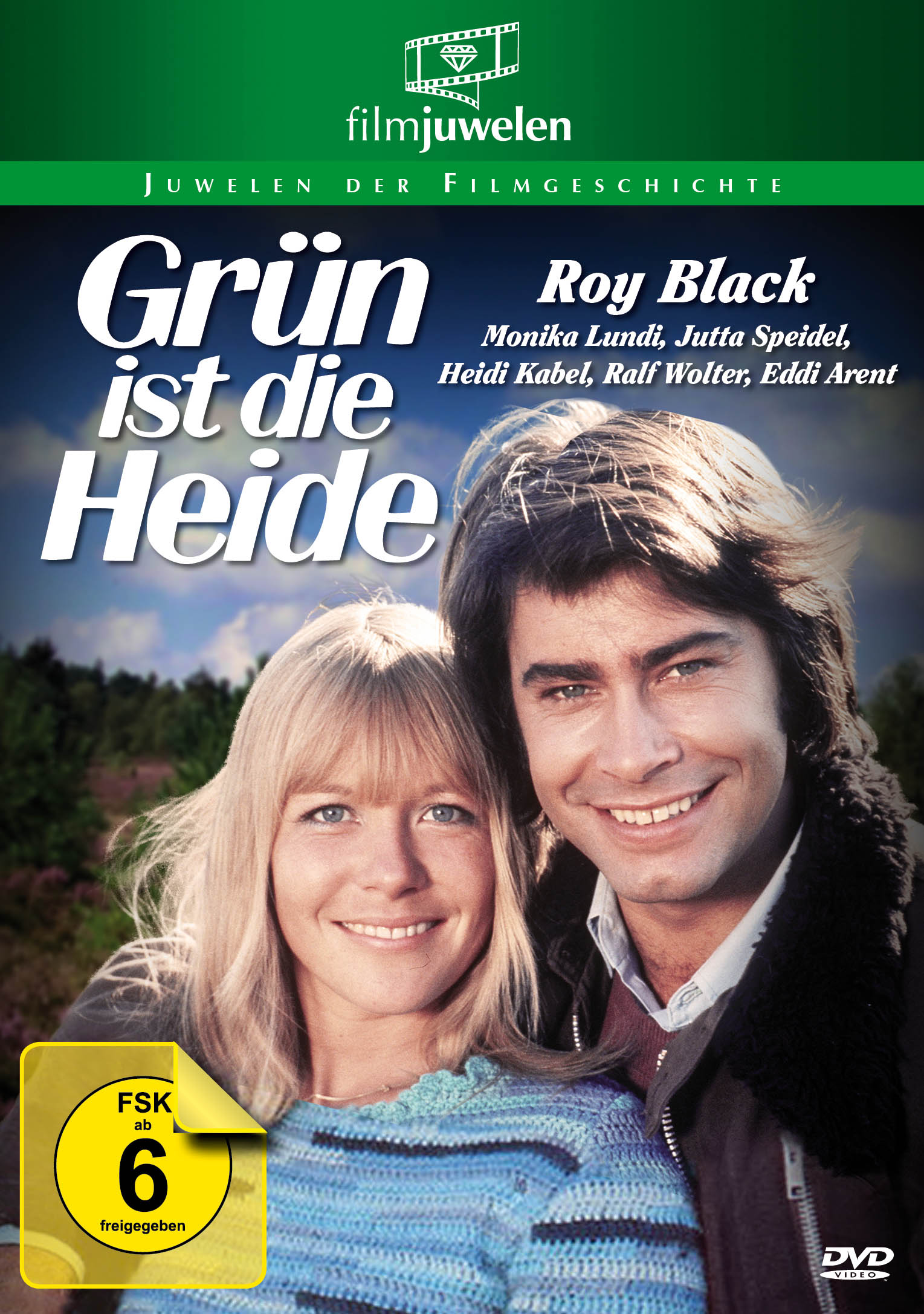 DVD-Cover von 'Grün ist die Heide'. Zwei lächelnde Personen, blonde Frau und Mann mit dunklen Haaren.