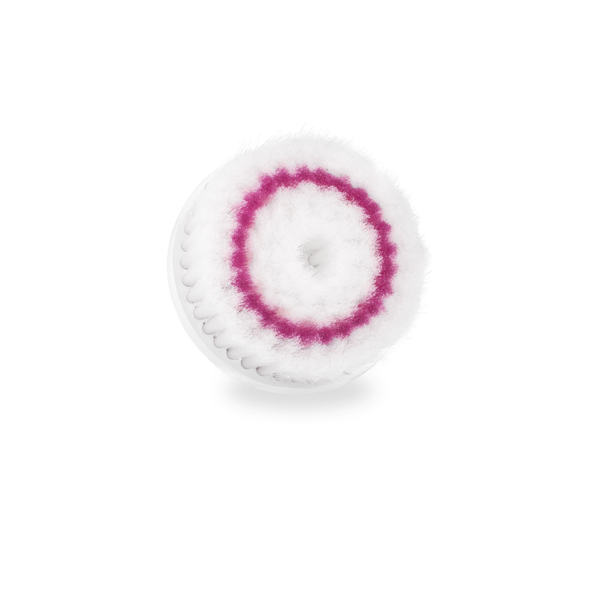 Eine weiße Gesichtsbürste mit rosa Innenkreisen. Sie ist rund mit kurzen Borsten. Der Hintergrund ist weiß.