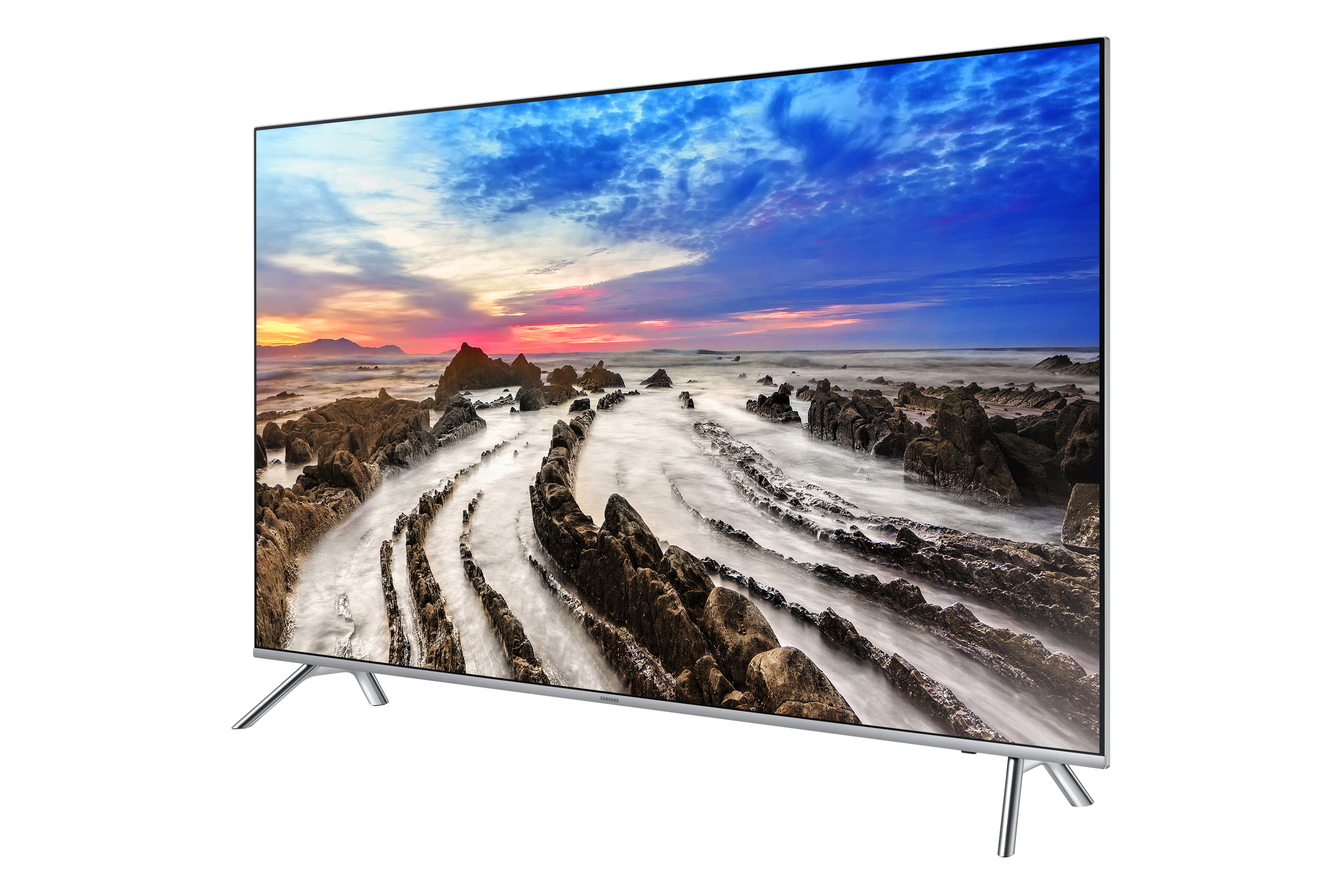 Flachbildfernseher. Zeigt einen Sonnenuntergang über einem felsigen Strand.