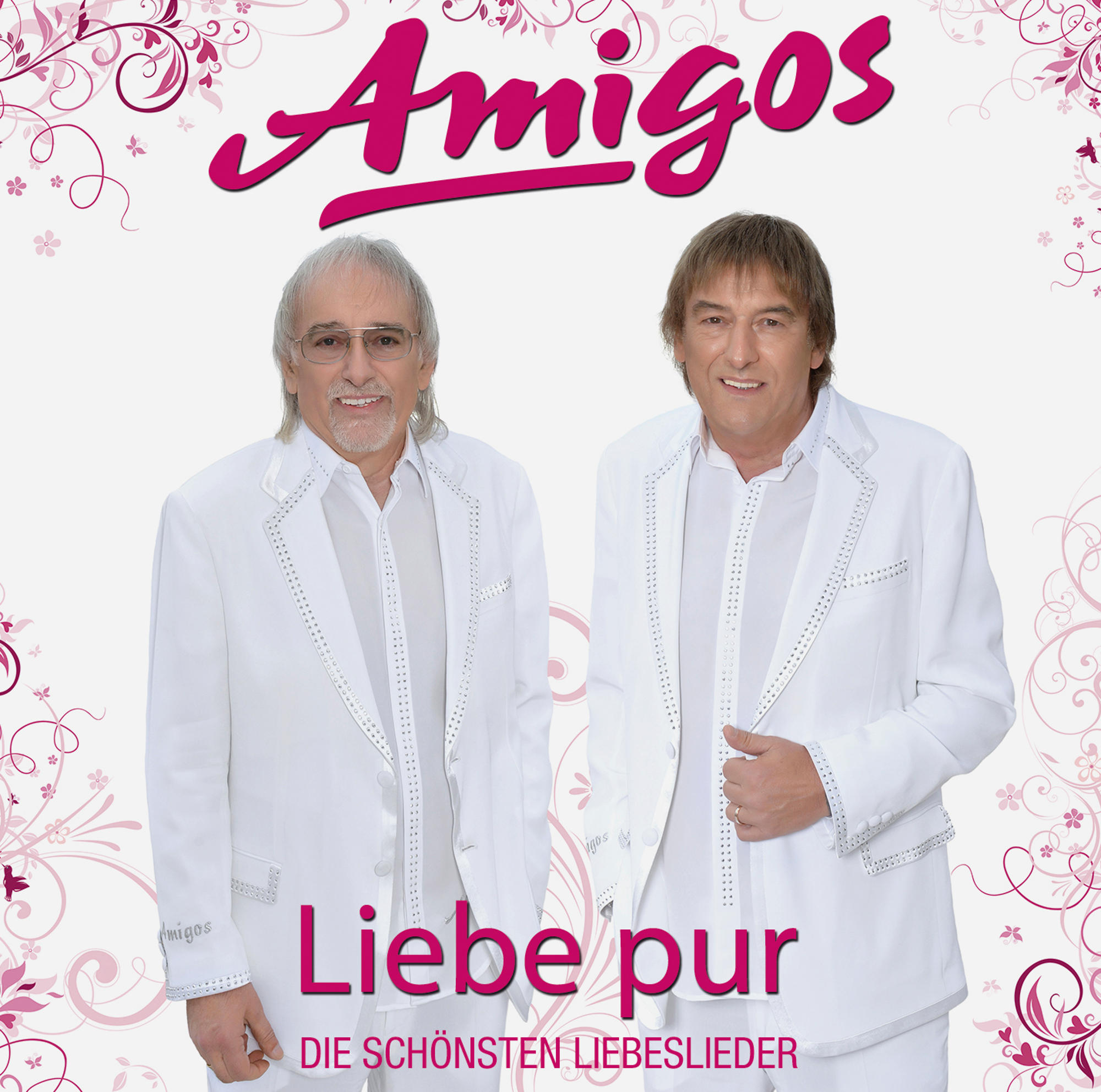 Albumcover von 'Amigos'. Zwei Männer in weißen Anzügen stehen vor einem rosa Blumendesign.