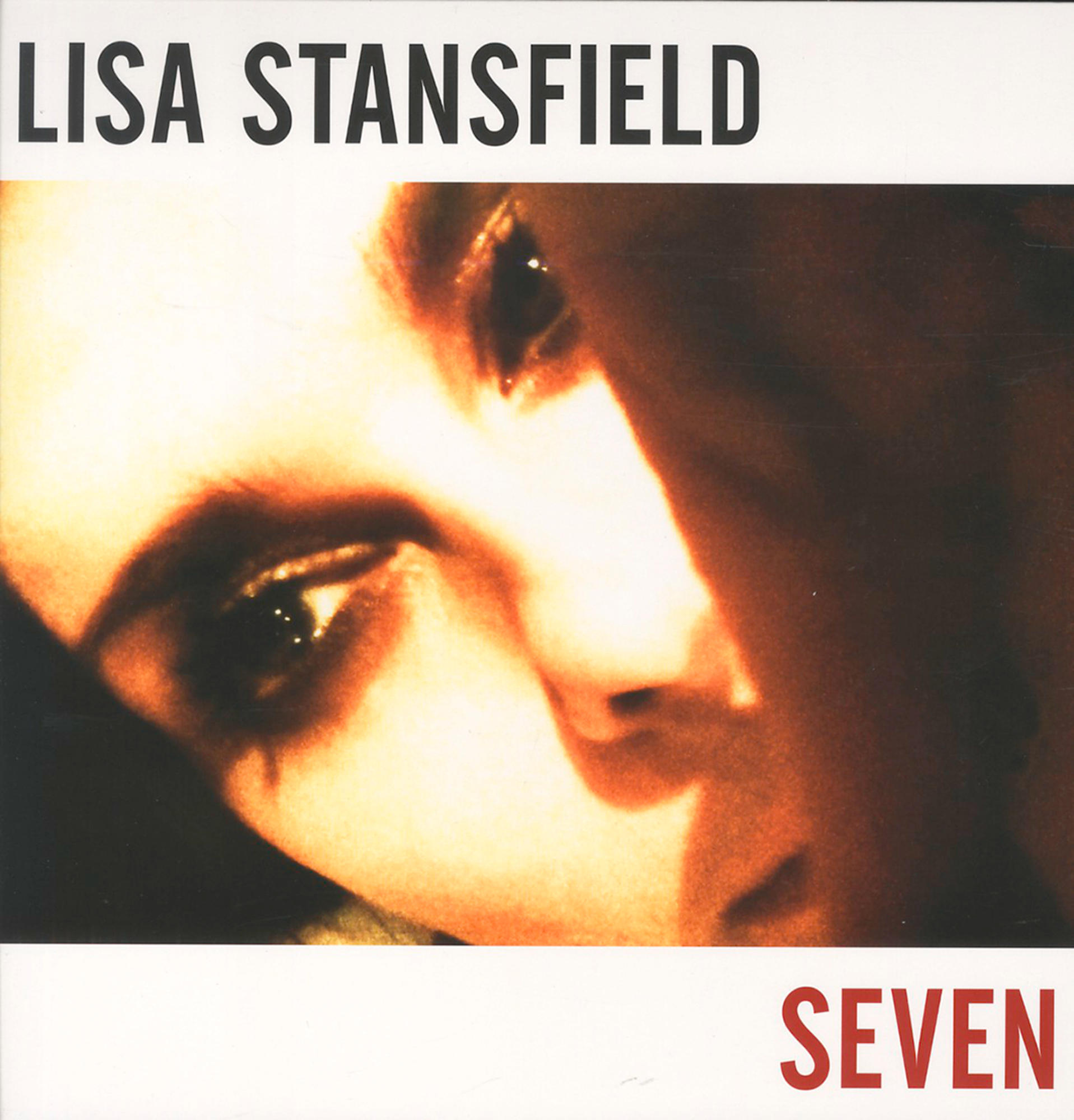 Albumcover: Nahaufnahme eines Frauengesichts. Titel: Seven.