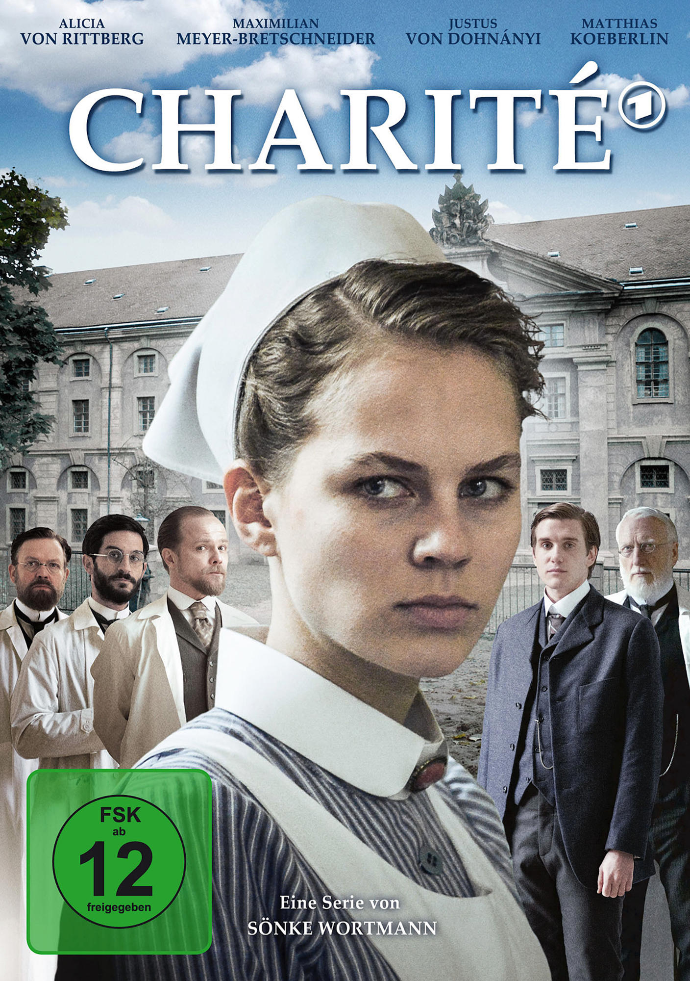 Filmplakat für Charité. Eine Frau in Krankenschwesteruniform blickt den Betrachter an. Andere Charaktere im Hintergrund.