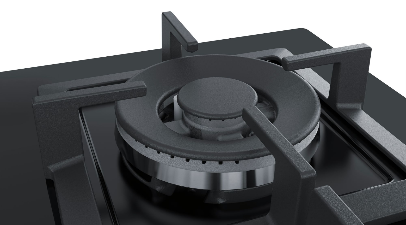 Close-up of a black gas stove burner with a black surface. The burner has a silver ring.