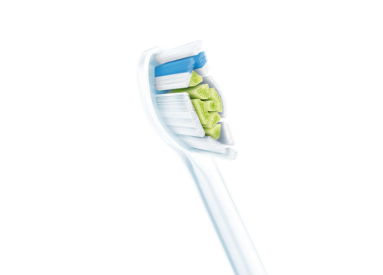 Close-up van een witte tandenborstelkop. Blauwe, witte en groene borstelharen zijn zichtbaar.