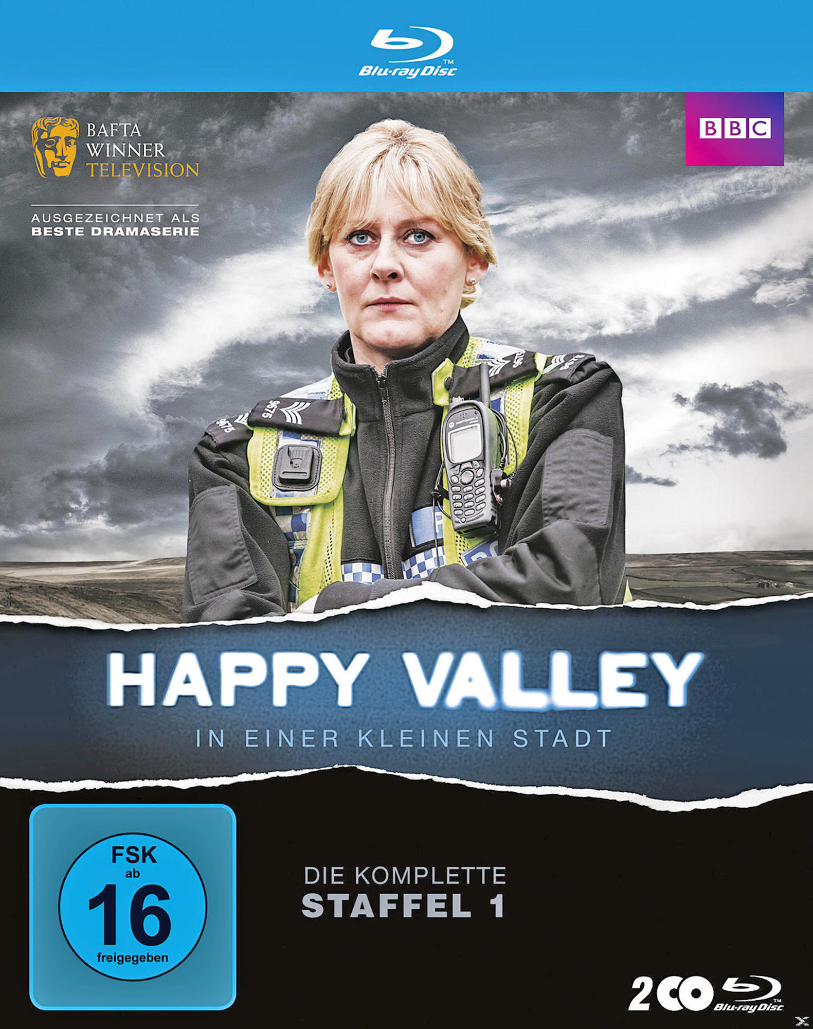 DVD-Cover mit einer Frau in Uniform. Titel ist 'Happy Valley'. Spielt in einer kleinen Stadt.