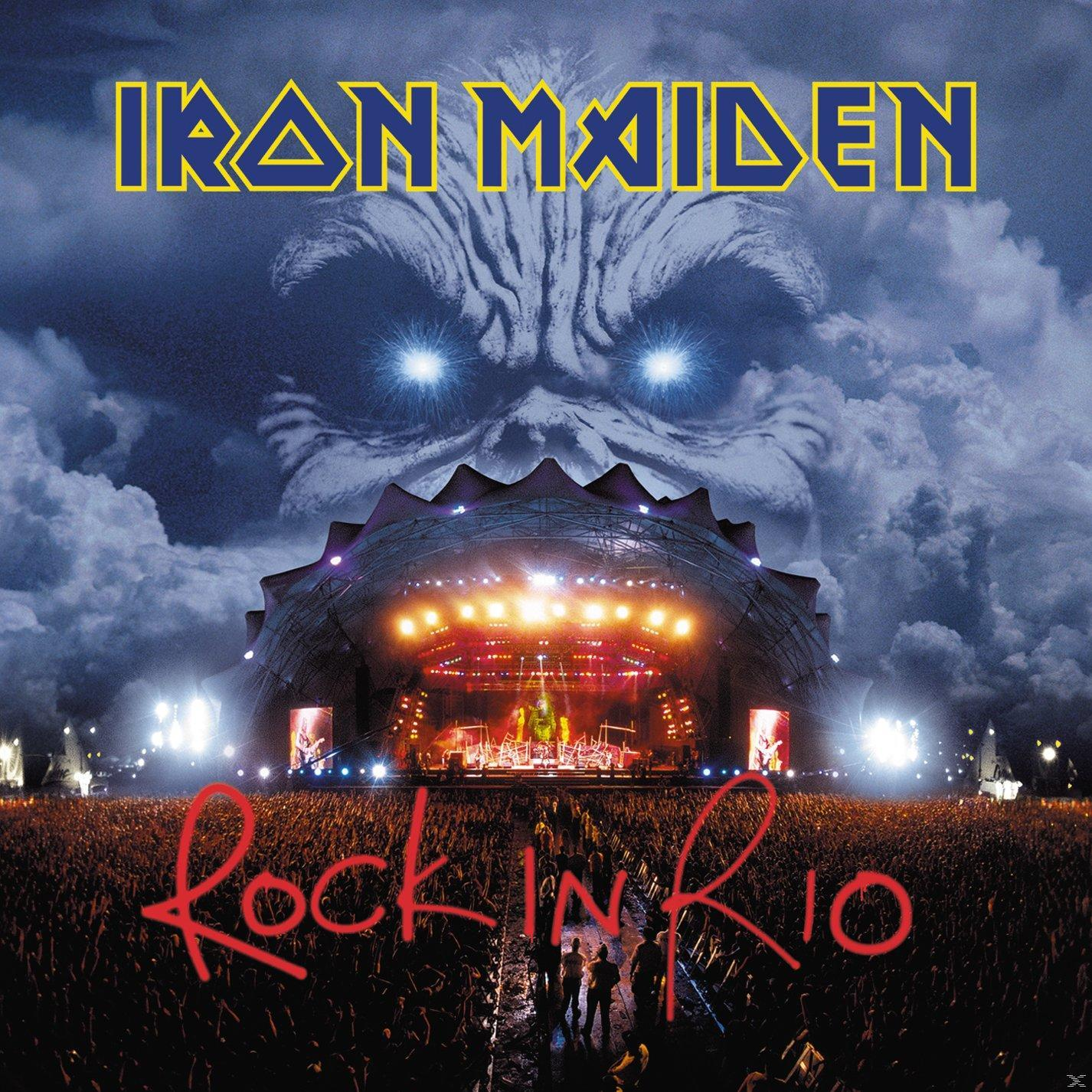 Iron Maiden Rock in Rio Albumcover. Bühne mit Menge, dunkle Wolken und Gesicht.