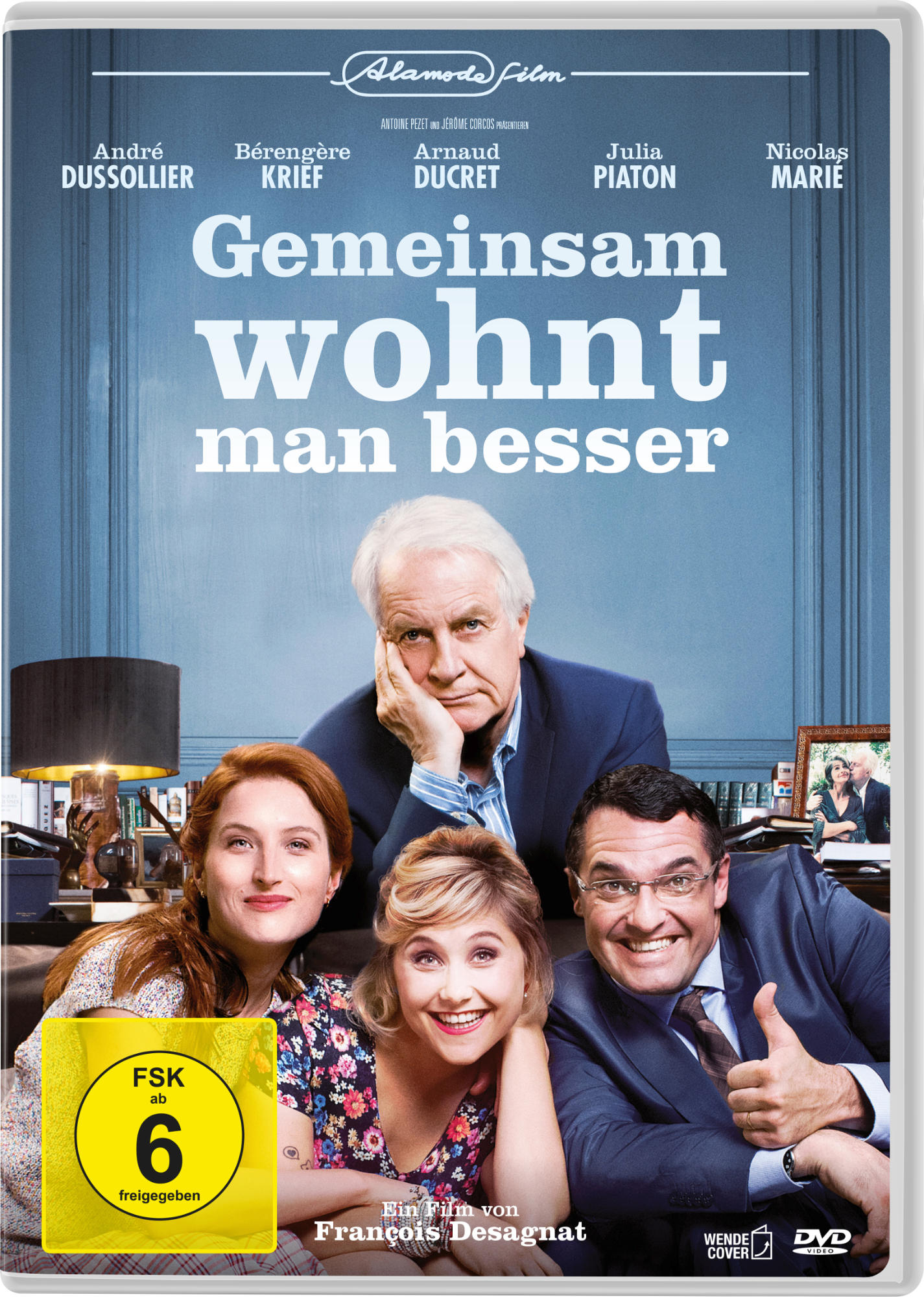 DVD-Cover mit vier Personen und Text in Weiß. Der Hintergrund ist blau.