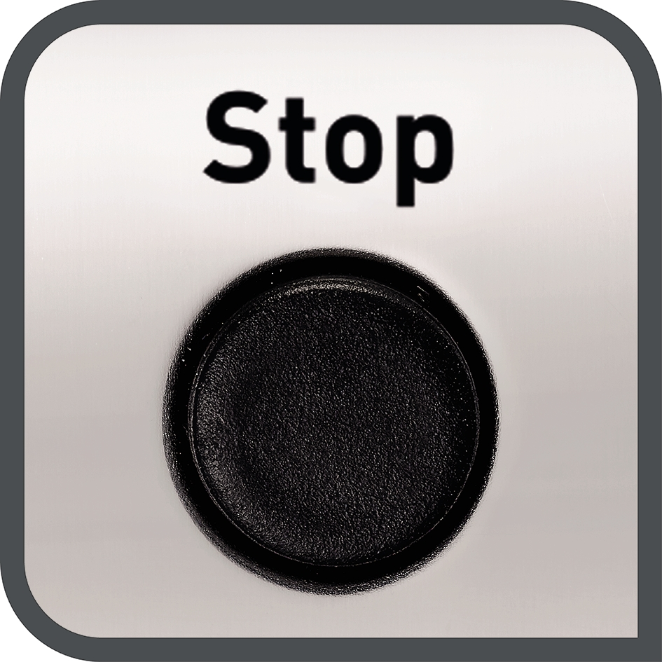 Een close-up van een zilverkleurige knop met 'Stop' erop geschreven, met een zwarte cirkel in het midden.