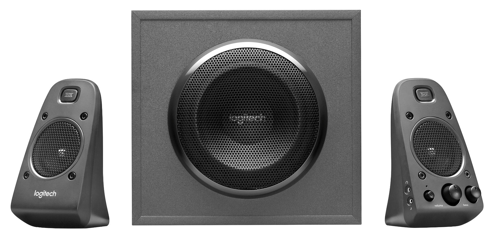 A set of three dark gray computer speakers: two small and one large subwoofer.