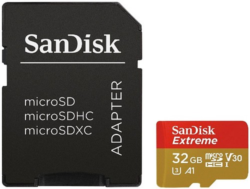 Carte MicroSD et adaptateur SanDisk. La carte est rouge et or, l'adaptateur est noir avec des étiquettes.