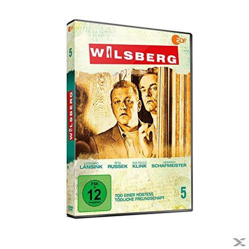 DVD-Cover: Zwei Männer schauen durch eine Tür. Der Titel ist Wilsberg. Das Cover ist gelblich.