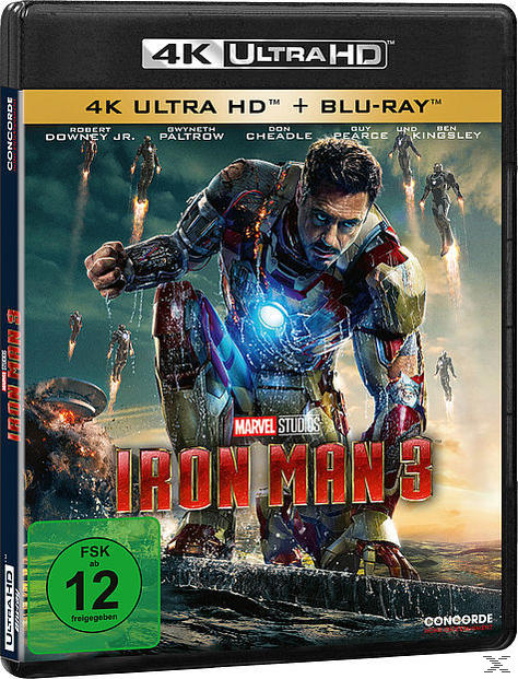 Iron Man 3 Blu-ray-Cover. Iron Man im Anzug fliegt über eine Stadt. Blaues und rotes Farbschema.