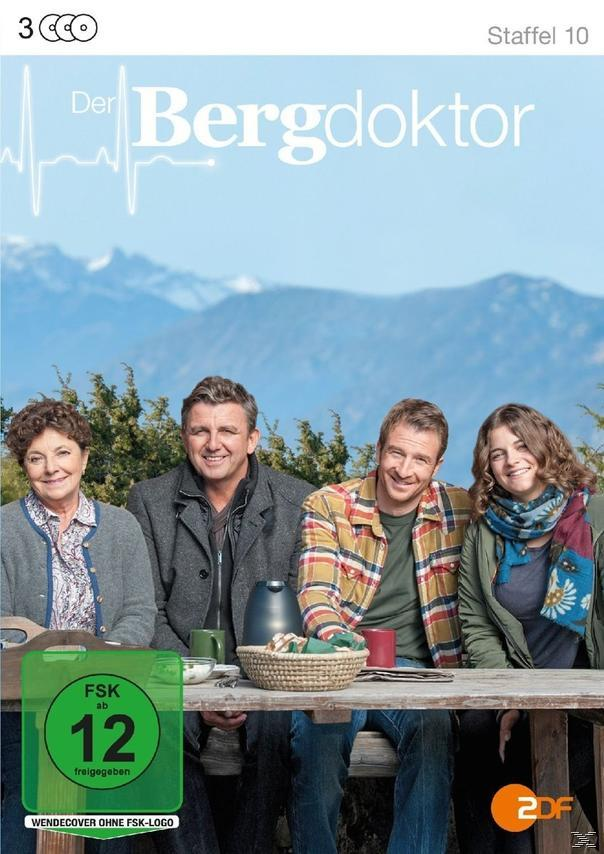 DVD-Cover für "Der Bergdoktor", mit vier Personen vor einem Bergpanorama. Ein grüner Bewertungsaufkleber ist vorhanden.