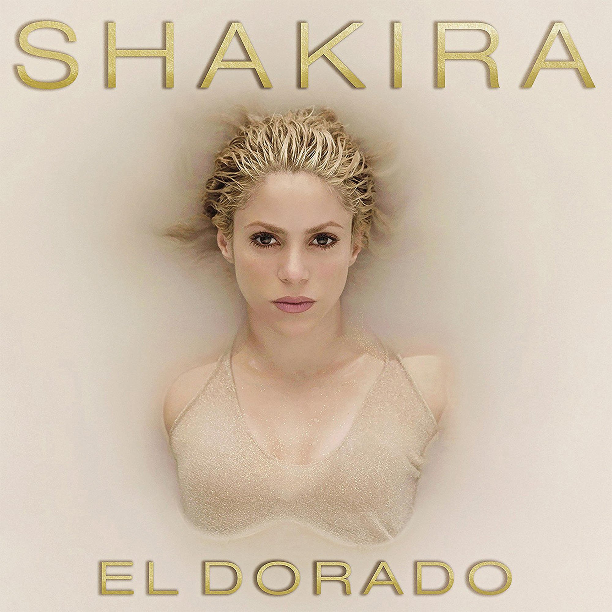 Shakiras Albumcover, EL DORADO, Shakiras Gesicht ist in einer milchigen Flüssigkeit zu sehen.
