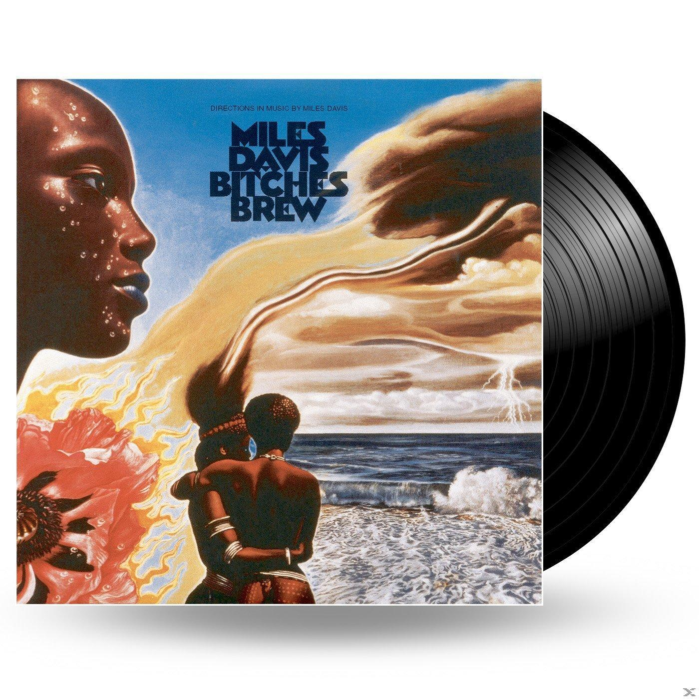 Albumcover. Ein schwarzer Mann mit blauer Gesichtsfarbe und Afro, mit zwei sich umarmenden Personen.