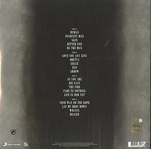 Albumcover mit Titelliste: Seite A, Seite B, Seite C, Seite D. Songtitel sind auf dunklem Hintergrund aufgeführt.