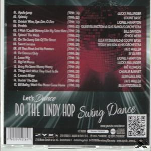Ein CD-Cover mit einer Liste von Songs und Künstlernamen auf rotem und weißem Hintergrund.