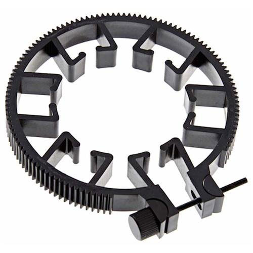 Zwart plastic tandwielvormig gereedschap met verstelbare klemmen en knoppen.
