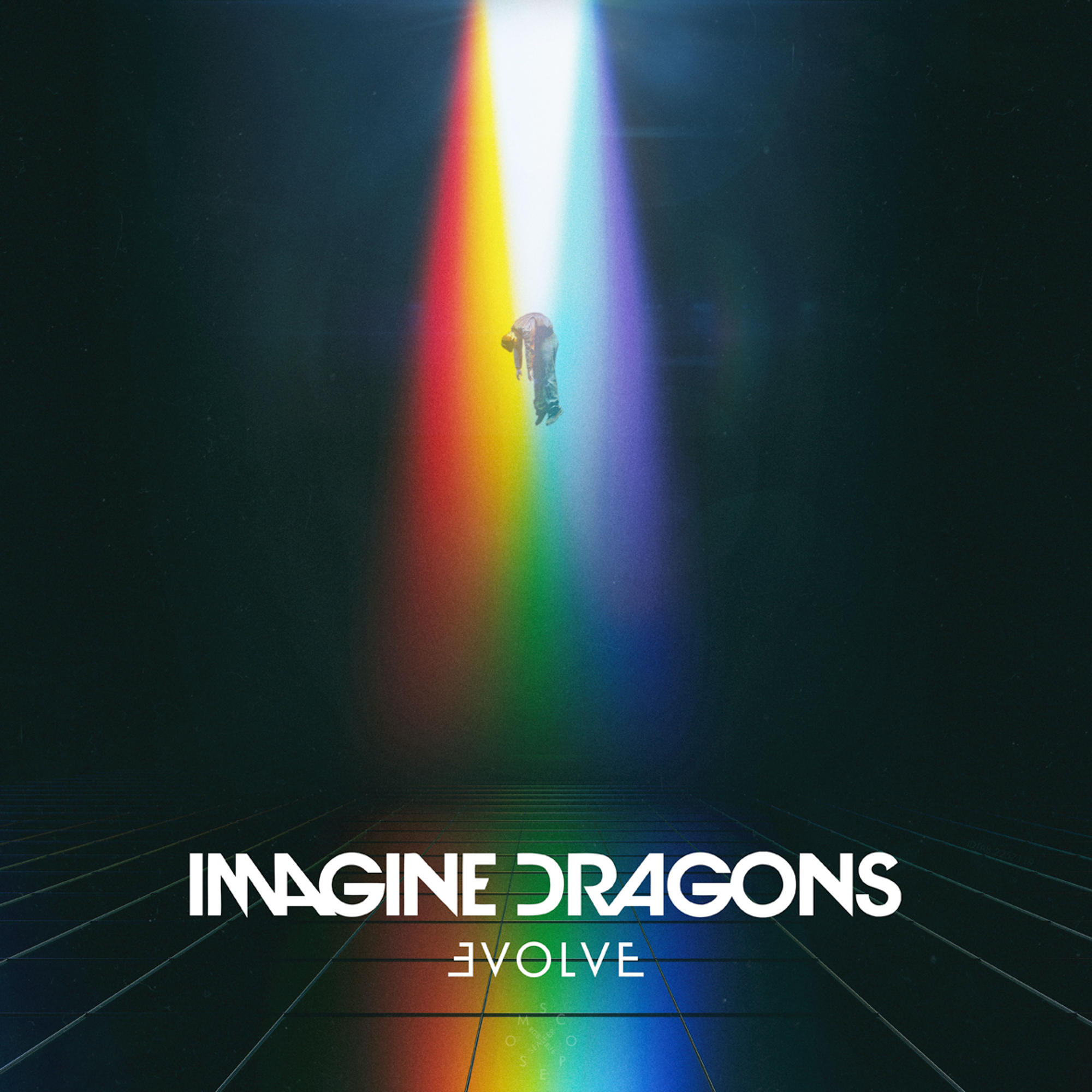 Mann in der Luft vor einem Regenbogen. Albumcover mit Bandname und Albumtitel.