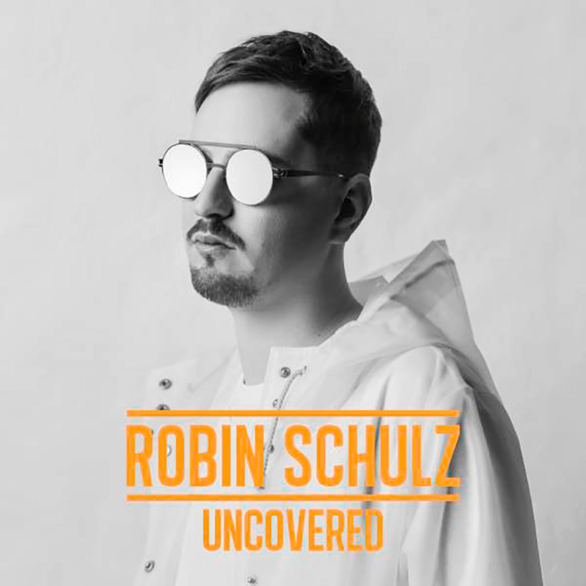 Pochette de l'album Robin Schulz. Homme portant des lunettes de soleil, texte orange 'Uncovered'.