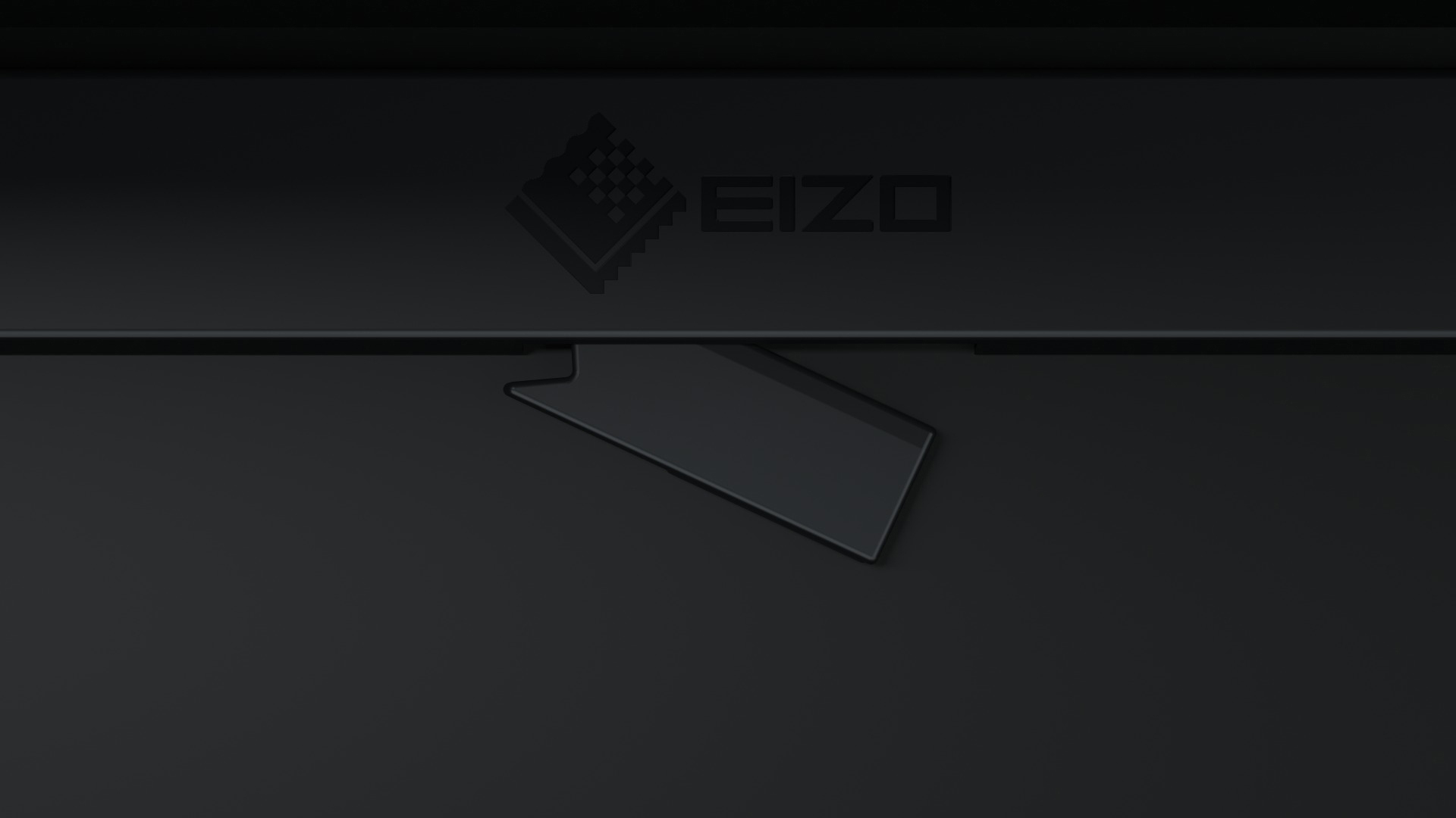 Nahaufnahme eines schwarzen EIZO-Monitors mit teilweise geöffnetem, abgewinkeltem Panel.