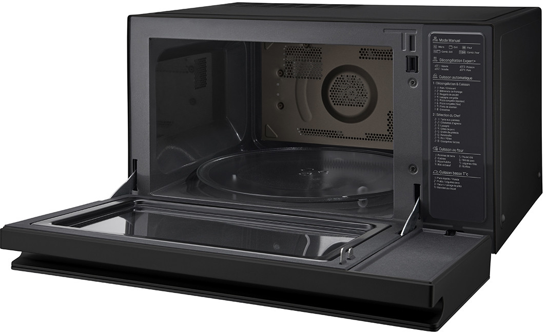 Black microwave with open door, showing a glass plate inside. Control panel and instructions visible on the right.