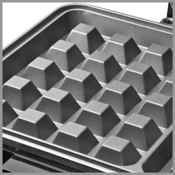 A waffle iron with a gray, square pattern.