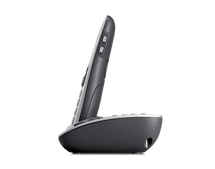 Side view of a cordless phone with a charging base.