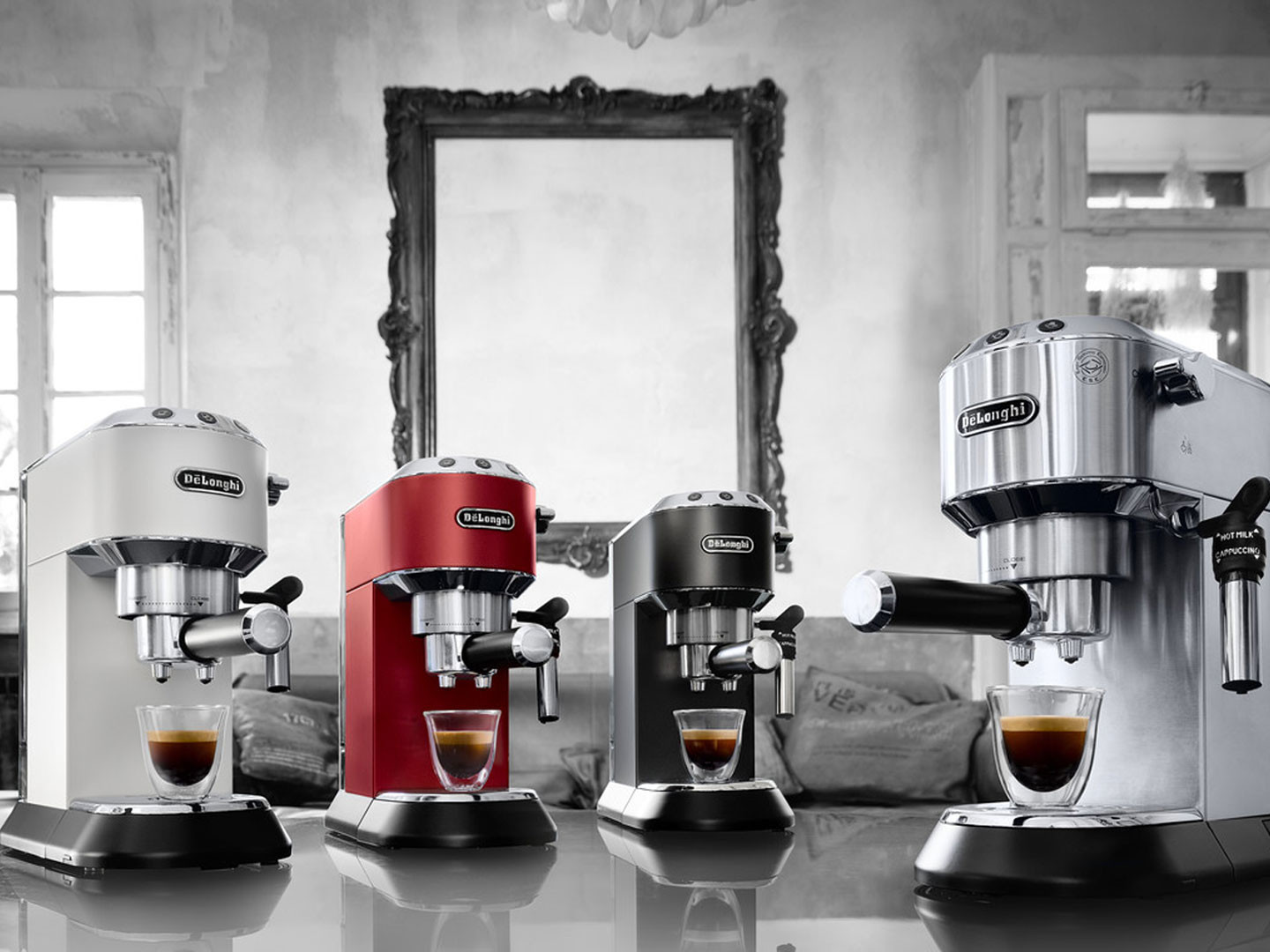 Four DeLonghi espresso machines. Different colors: white, red, black, and silver, with coffee cups.