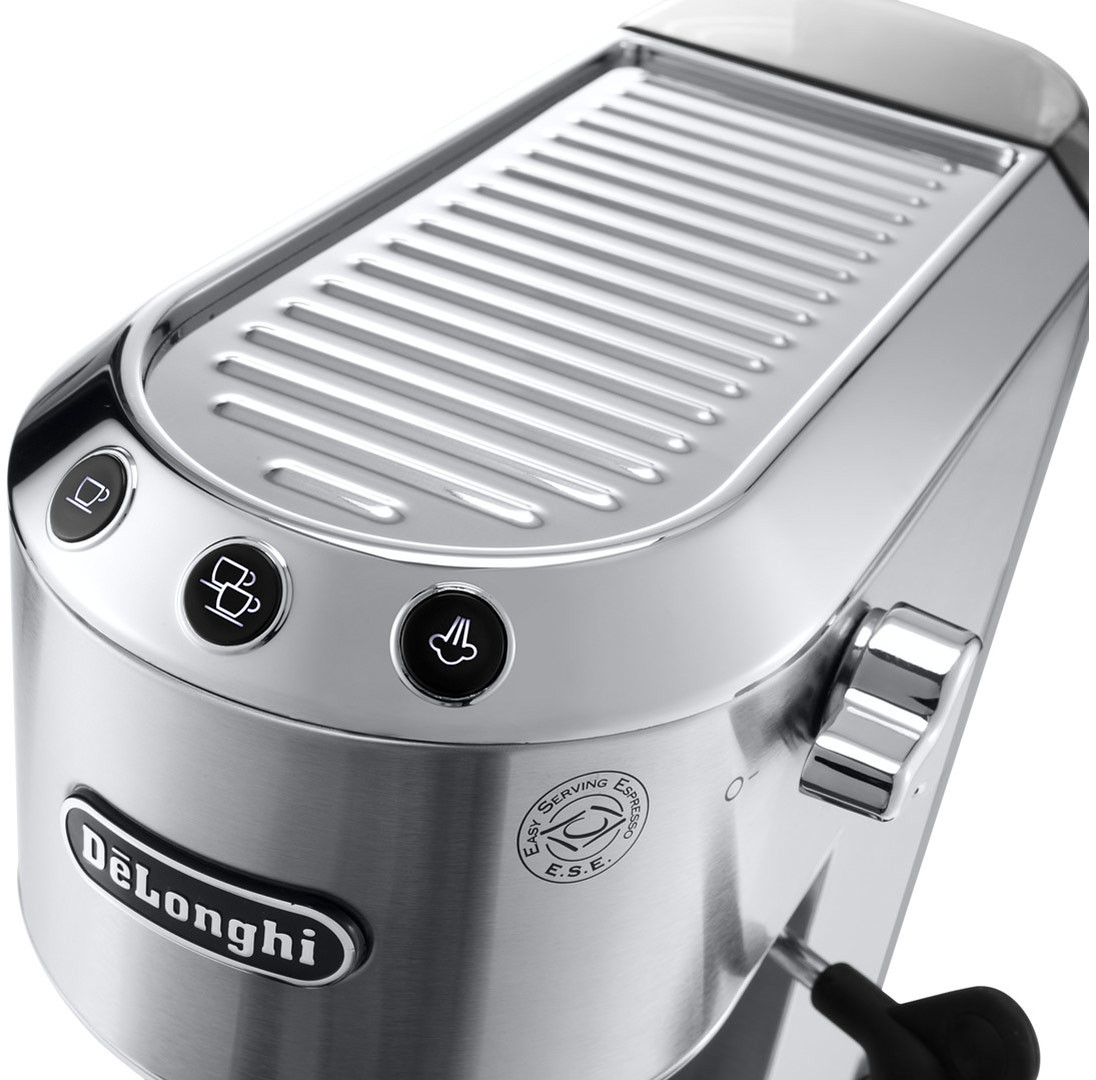 Close-up of a silver espresso machine. Buttons on the front. 'DeLonghi' printed on the base.