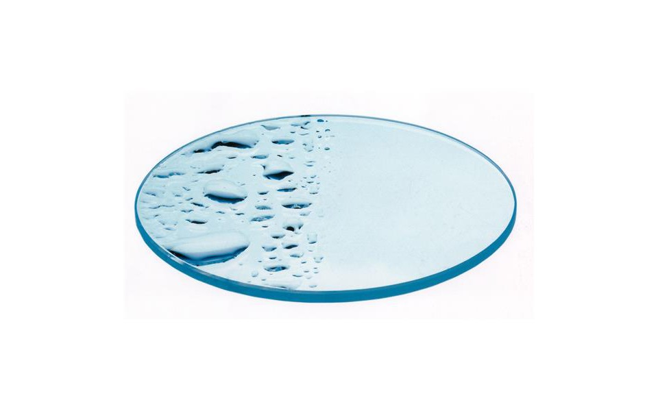 An oval glass surface. Half covered with water droplets. The other half is clean. Blue border. White background.