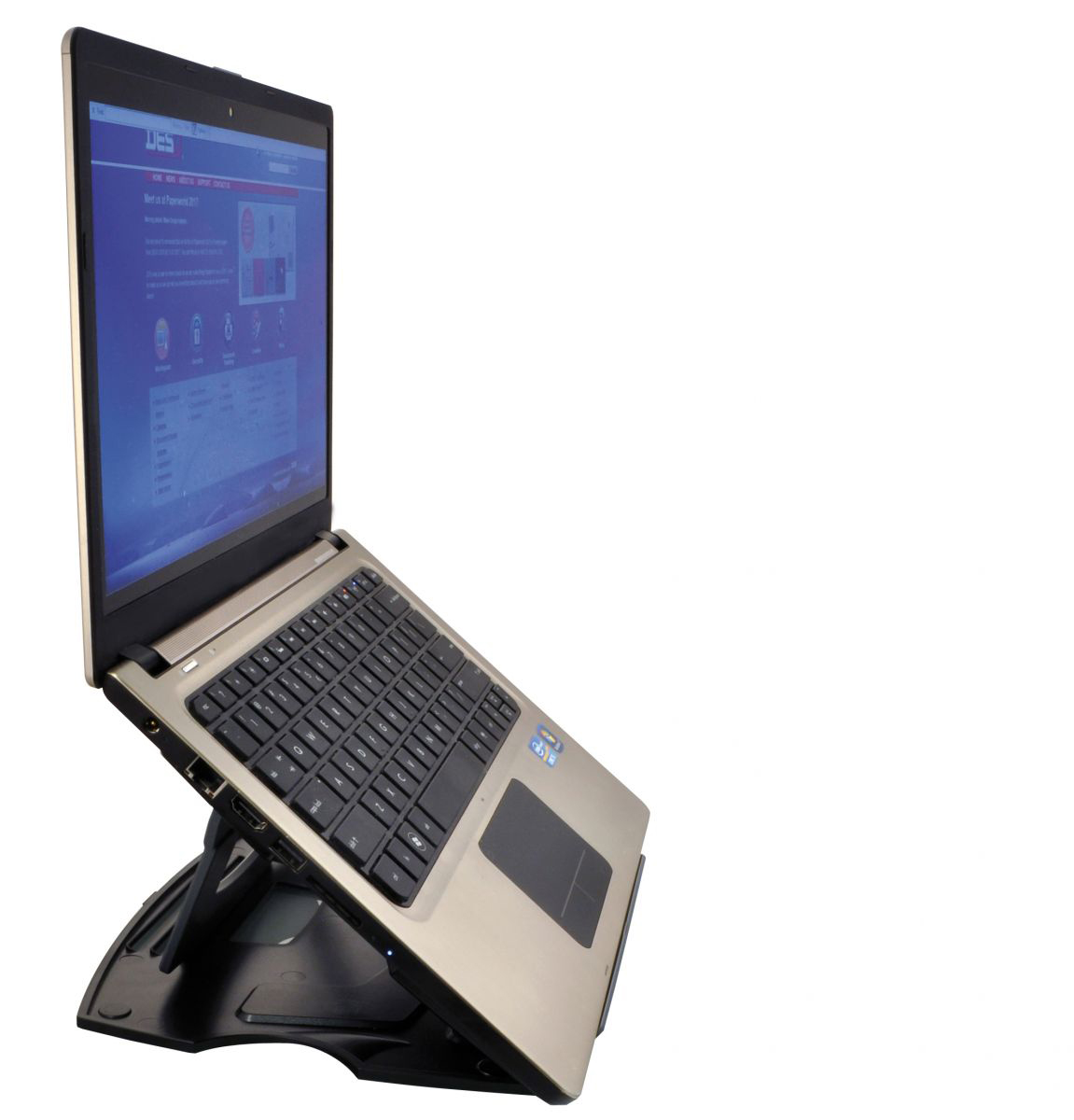 A silver and black laptop on a black stand, displaying a webpage on the screen.