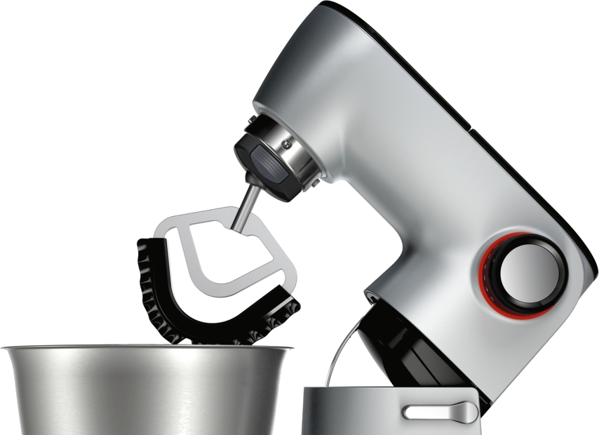 Ezüst és szürke konyhai mixer egy tálban. A mixer fekete felületen van.