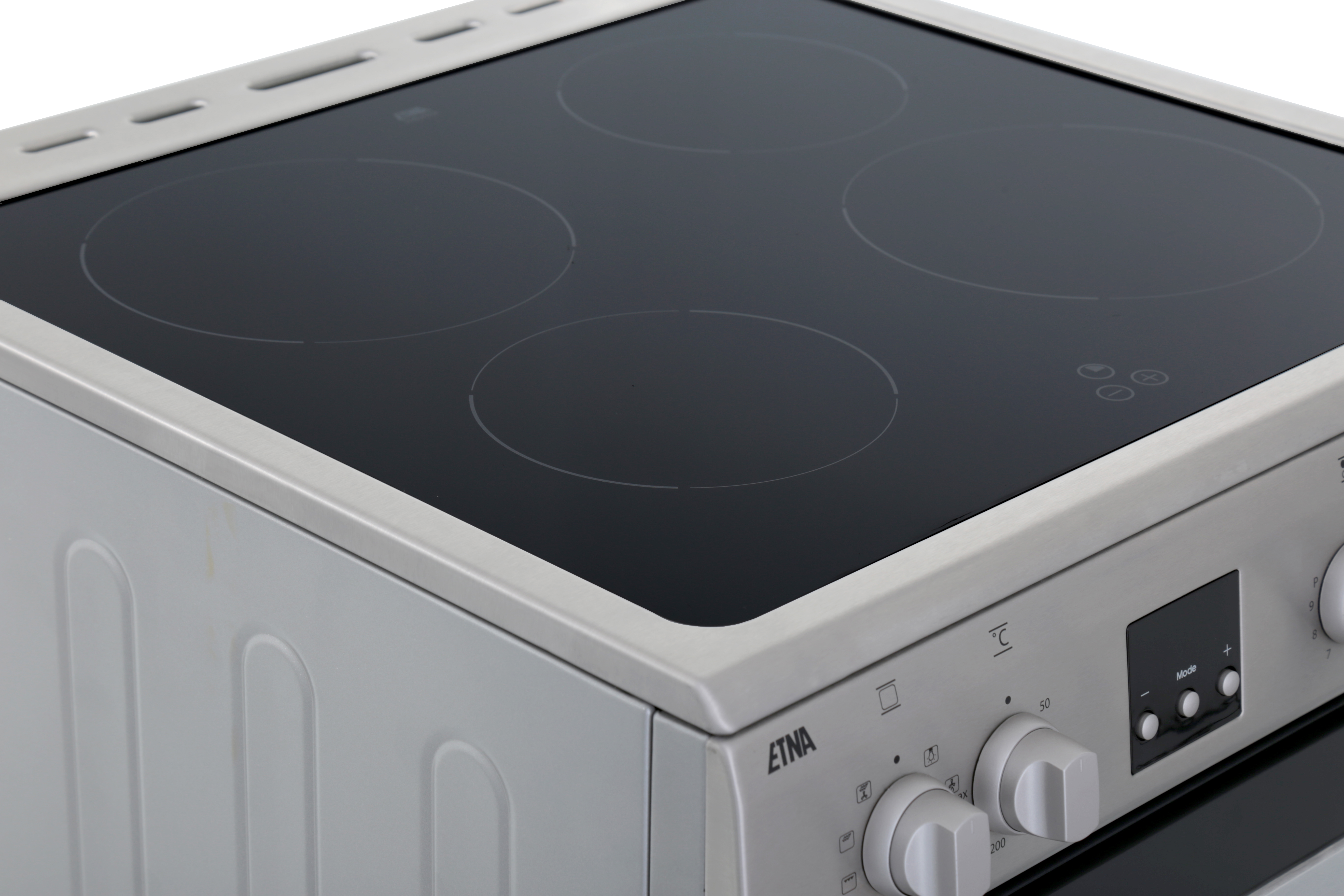 A close-up of a silver electric stove with four circular cooking zones and control knobs.