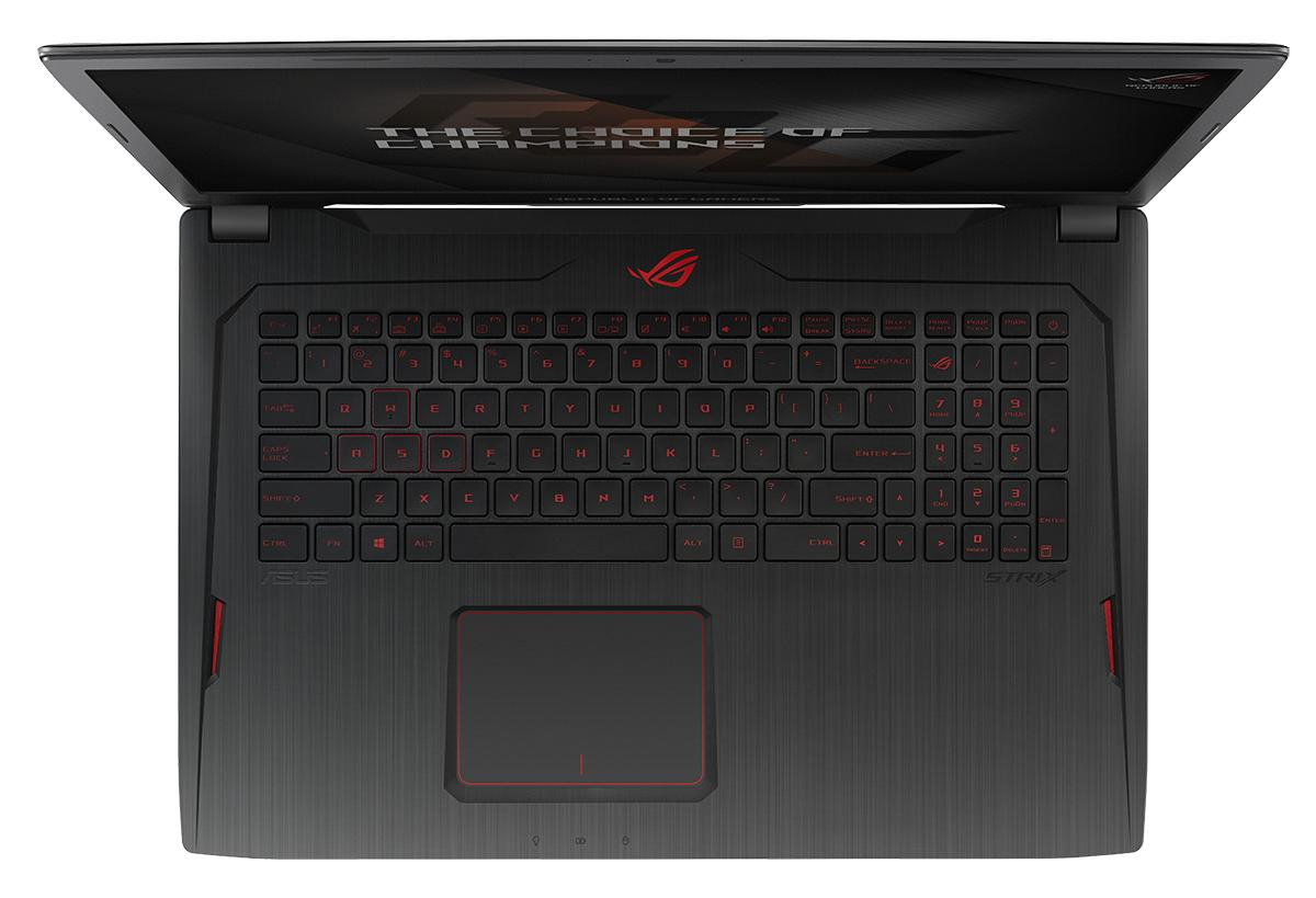 Draufsicht auf Laptop mit offenem Bildschirm, schwarzem Gehäuse, roter Tastaturbeleuchtung, ASUS ROG Logo.