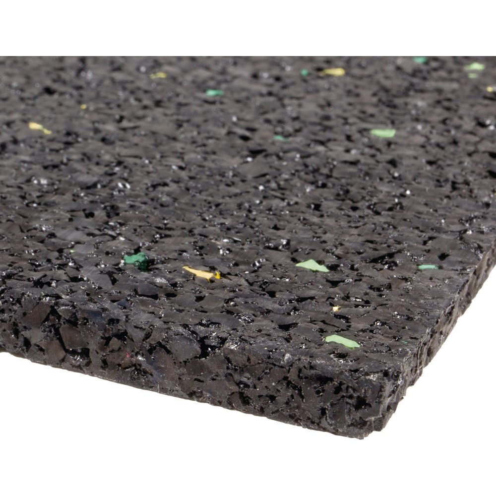 A black rubber flooring with mixed colored chips, close-up shot.