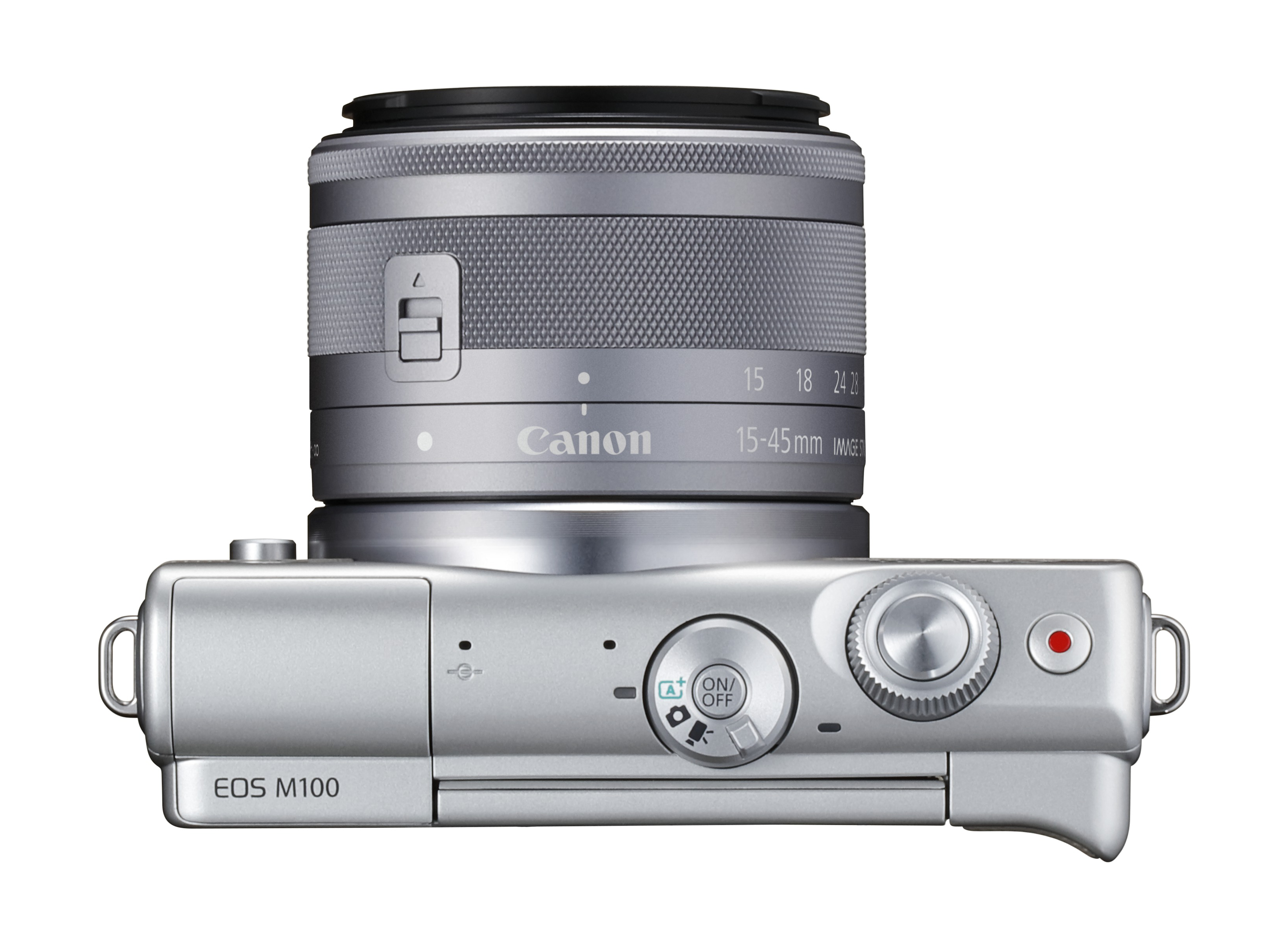 Zilveren Canon EOS M100 camera, bovenaanzicht, met lens. Witte achtergrond.