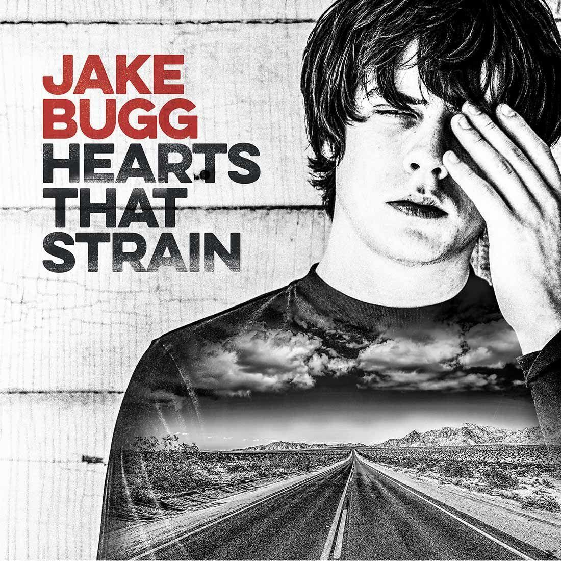 Albumhoes: Jake Bugg, 'Hearts That Strain'. Afbeelding van een weg en lucht.
