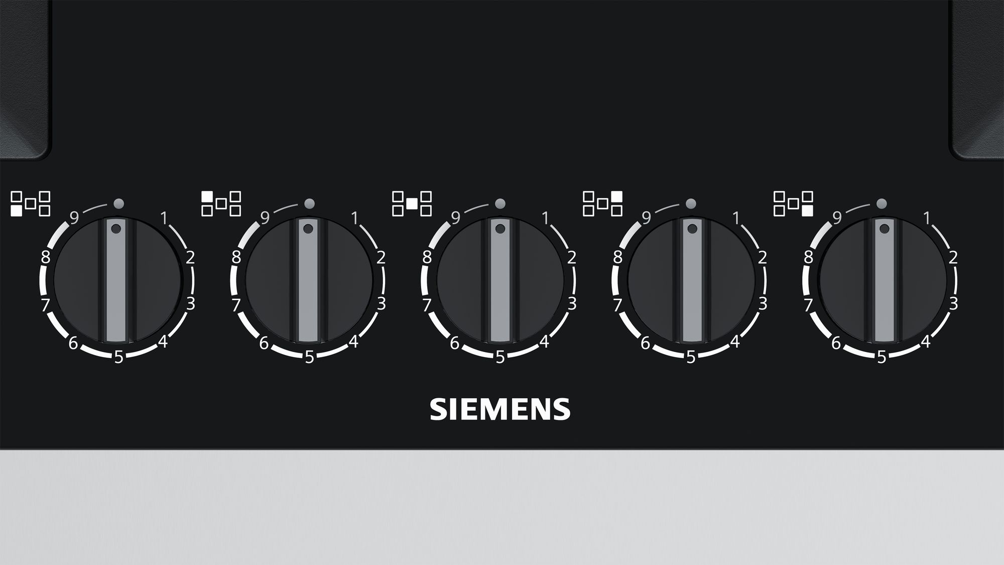 A close-up of a black stovetop with five circular knobs with numbers.