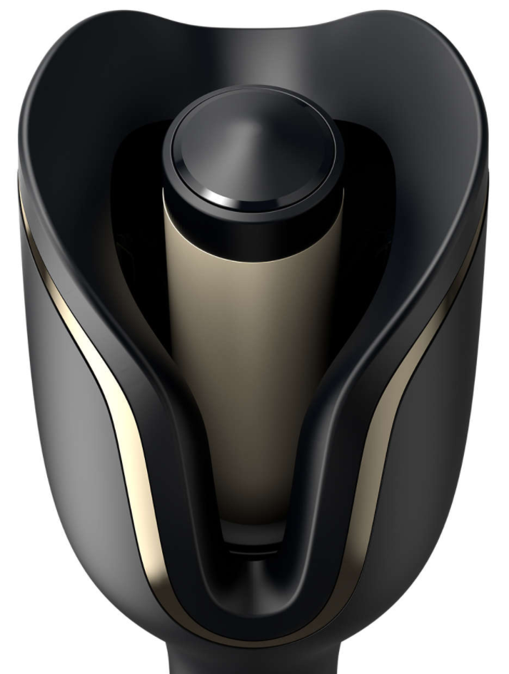 Black and gold hair curler. The curler has a unique design.
