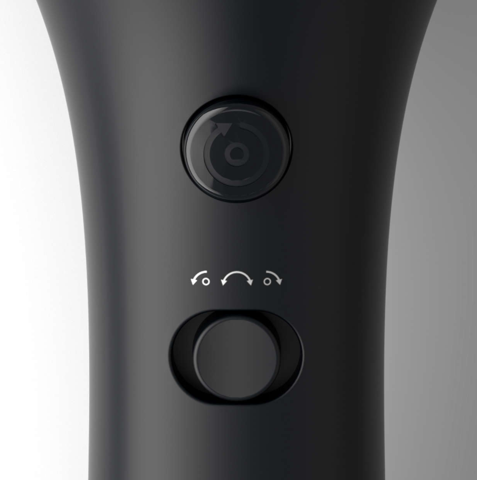 Close-up of a black device with power and function buttons, and a rotating dial.