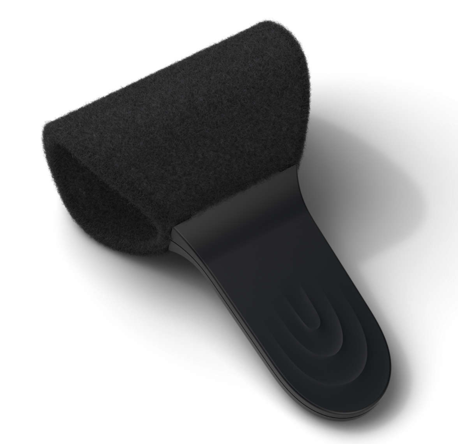 Black, textured foam pad with a plastic handle, designed for cleaning or polishing.