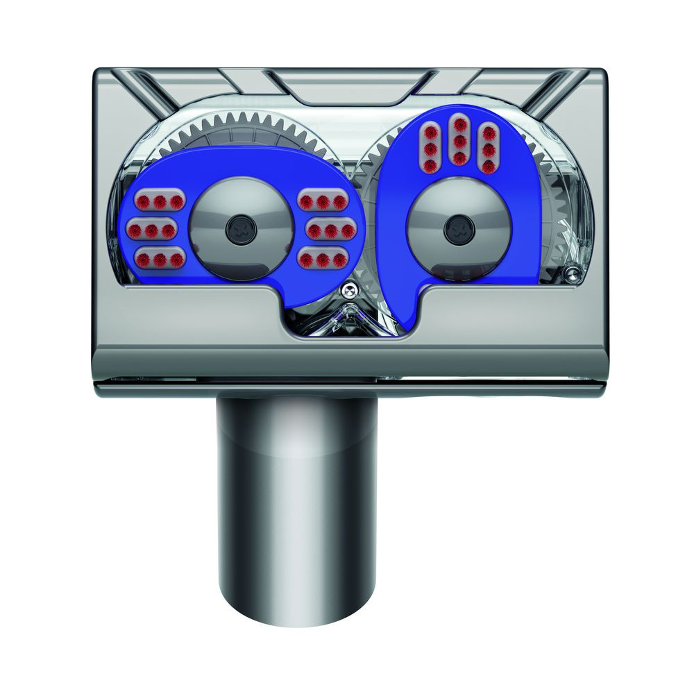 Close-up of a silver and blue mechanism. The mechanism has two blue circular components with red dots.