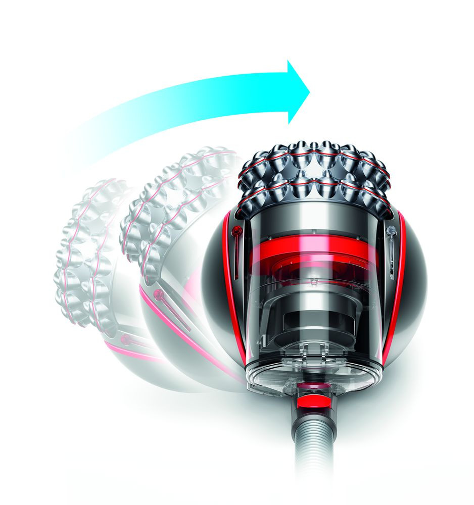 A Dyson vacuum cleaner in action, with an arrow showing its movement.