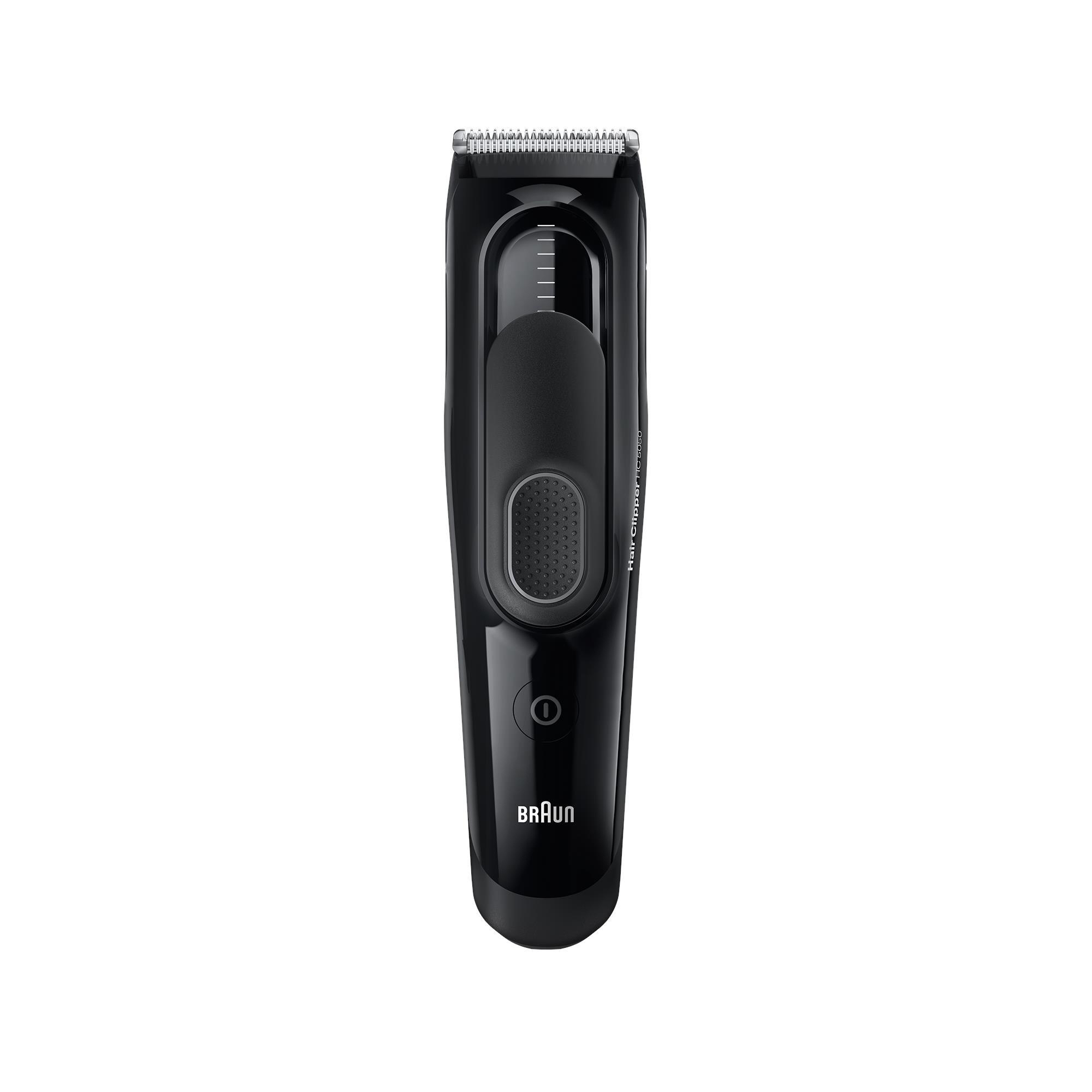 Schwarzer Braun Haarschneider. Der Clipper hat einen Power-Knopf und einen Längeneinstellknopf.