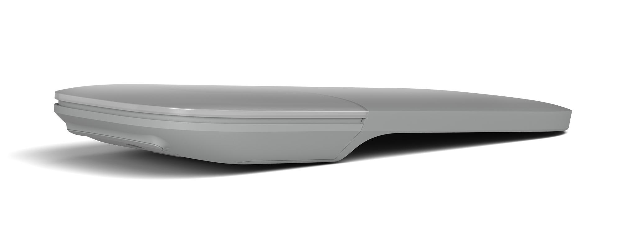 A gray, flat, elongated object. Possibly a mouse or remote.
